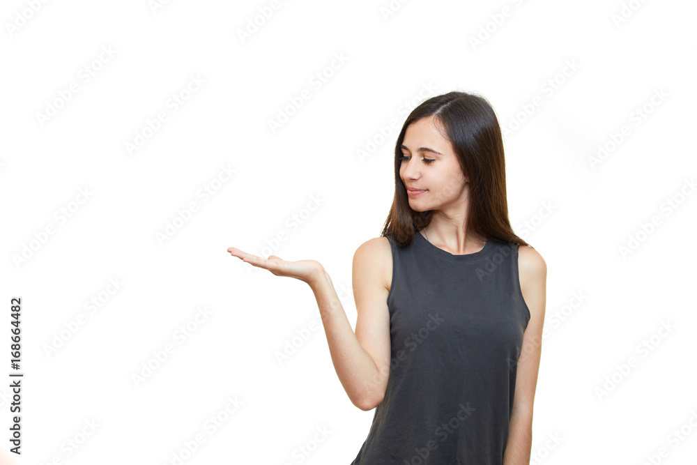 Young excited woman standing happy smiling holding her hand showing something on the open palm. Girl emotions. White background. Young excited woman standing happy smiling holding her hand showing something on the open palm. Girl emotions. White background.