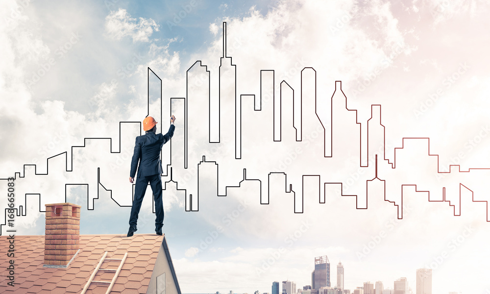 Man architect draw silhouette of modern city on blue sky. Mixed Man architect draw silhouette of modern city on blue sky. Mixed