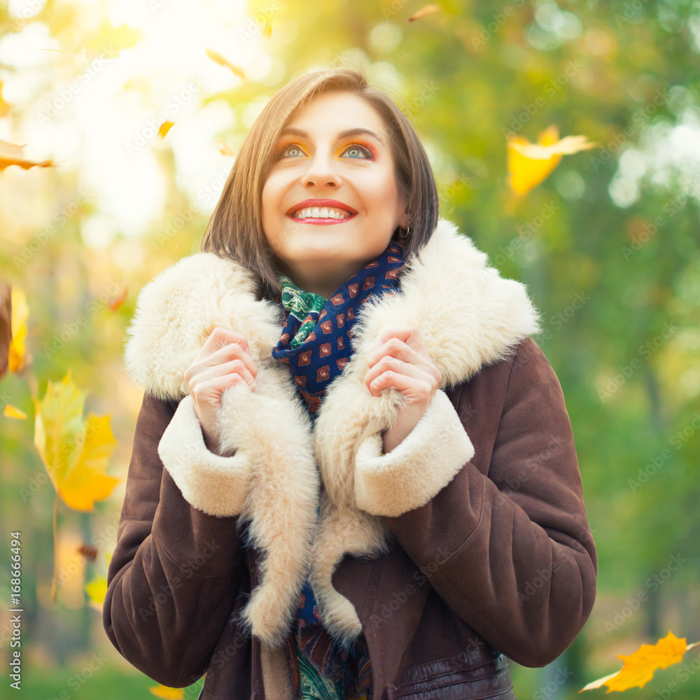 Young woman posing in autumn park Young woman posing in autumn park