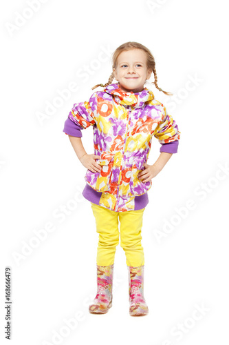 Girl in autumn clothes and rubber boots