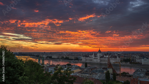 Budapest, Hungary - Dramatic colorful clouds and sunrise over Budapest and the Hungarian Parliament