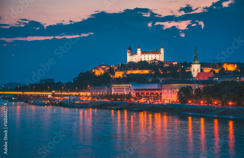 Castle of Bratislava  Slovakia at Night as Seen from a Bridge over Danube River Towards Old Town of Bratislava.
