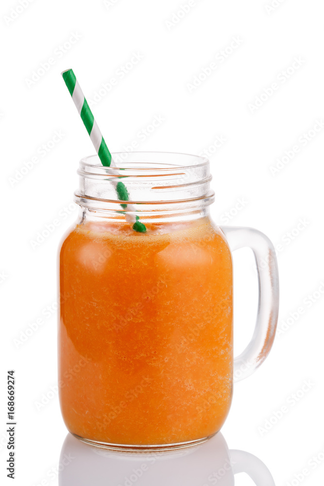Smoothies of mango, orange and carrot isolated on white background. Freshly prepared drink made from fruits and vegetables in a glass jar Smoothies of mango, orange and carrot isolated on white background. Freshly prepared drink made from fruits and vegetables in a glass jar