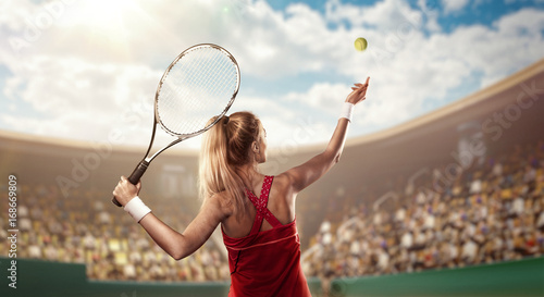 tennis player serving on court © TandemBranding