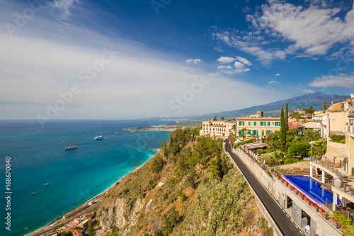 Panoramic sea view from Taormina main square Piazza 9 Aprile, overlooking Giardini Naxos bay, Taormina, Sicily, Italy photo