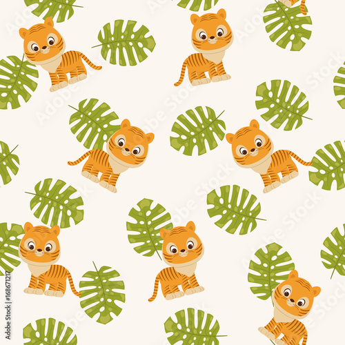 Fototapeta Naklejka Na Ścianę i Meble -  Tiger cub and tropical leaves.