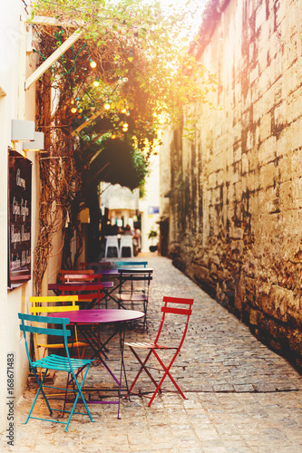 Photography Empty coffee terrace with tables and chairs on South of France