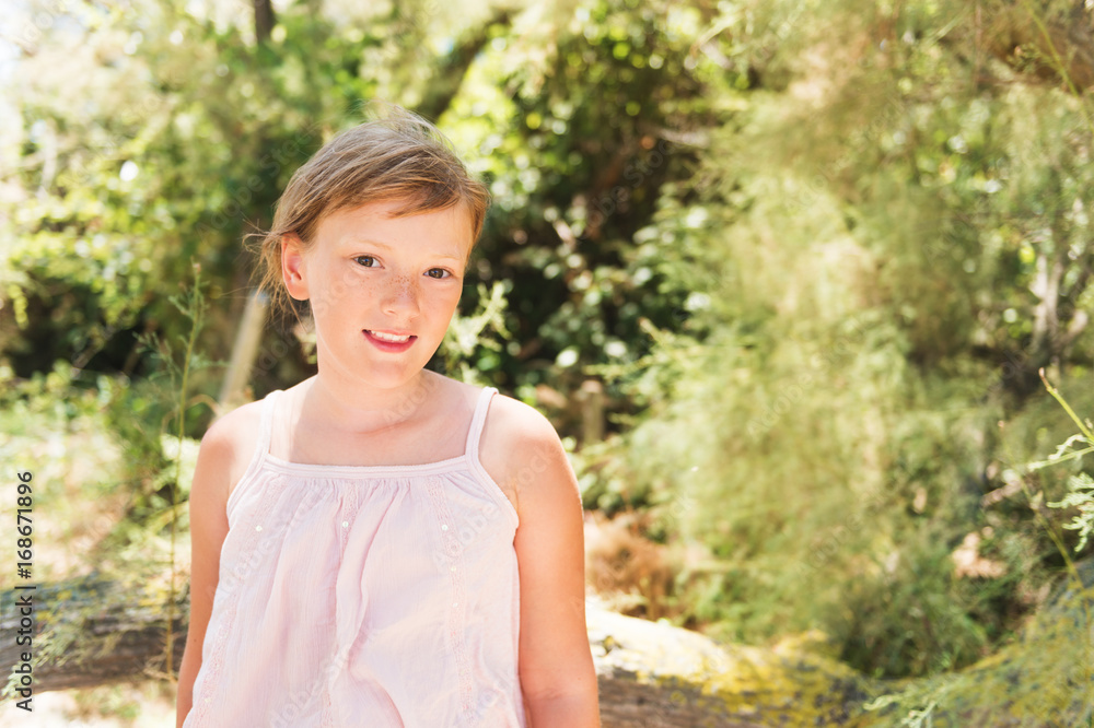 Cute little girl enjoying promenade in summer park Cute little girl enjoying promenade in summer park