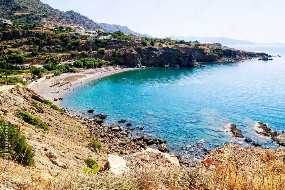 Turquoise blue ocean waters coastline southeast Crete, Greece.