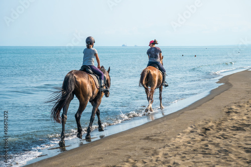 Fototapeta Naklejka Na Ścianę i Meble -  Galloping on a horse of the sea at sunny day.