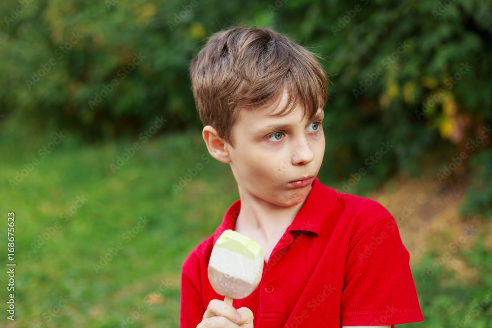 Surprised boy with ice-cream. Childhood, emotions and states of mind concept Surprised boy with ice-cream. Childhood, emotions and states of mind concept