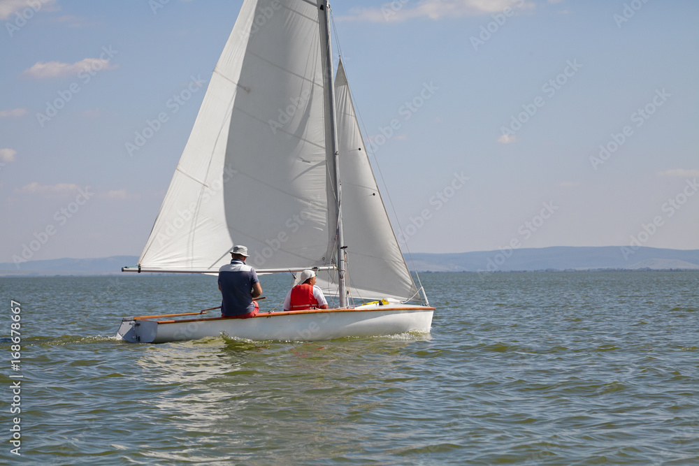 Fototapeta premium Two man drive a sport sailing yacht in competition