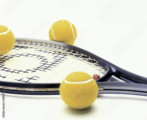 Tennis racquet with balls photo