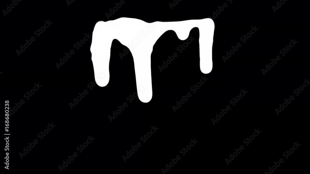 White ink dripping over black screen background. Close-up shot White ink dripping over black screen background. Close-up shot