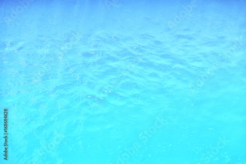 Waving water surface background in the pool.