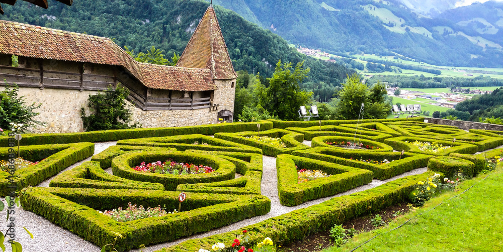 Φωτογραφία Gruyeres Castle, the French garden behind the chateau surrounded by ramarts
