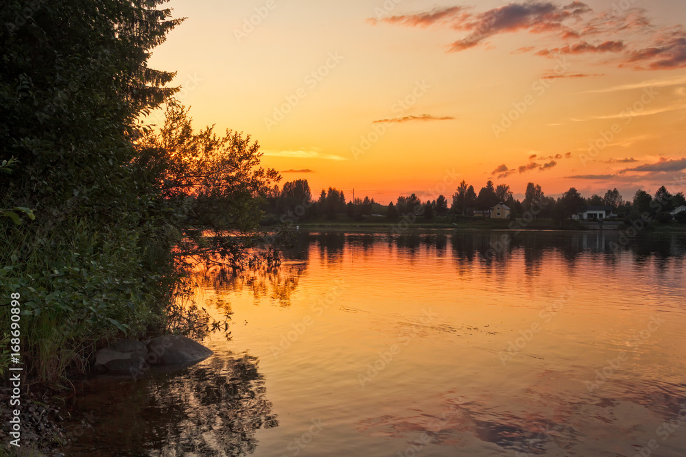 Obraz premium Sunset By The River Kemijoki