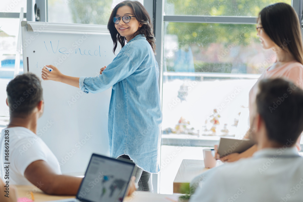 Obraz premium Smart creative woman holding a highlighter