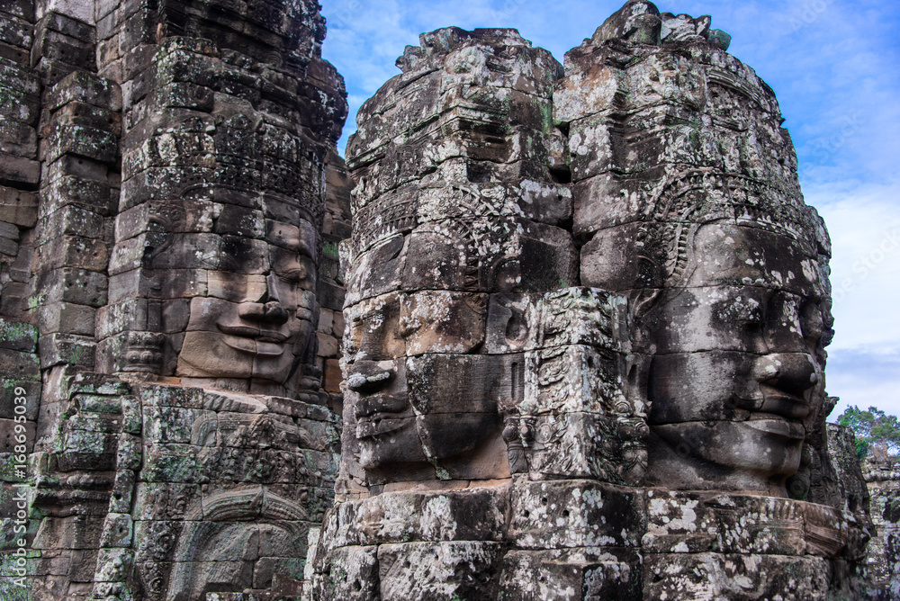 Prasat Bayon with smiling stone faces is the central temple of Angkor Thom Complex, Siem Reap, Cambodia. Ancient Khmer architecture and famous Cambodian landmark, World Heritage.