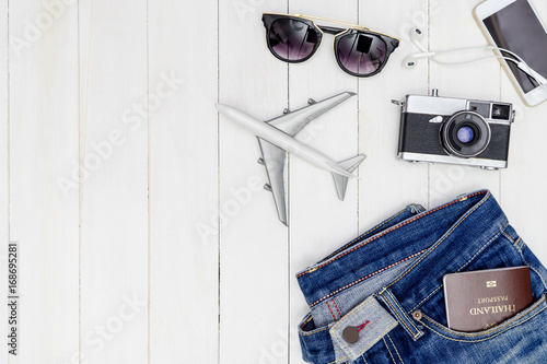 Hipster male travel objetcs and fashion on white wooden copy space photo