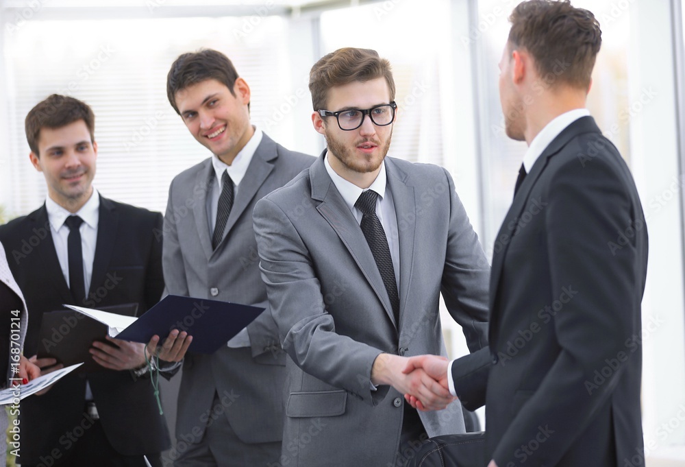 Fototapeta premium welcome and handshake of business partners on the briefing