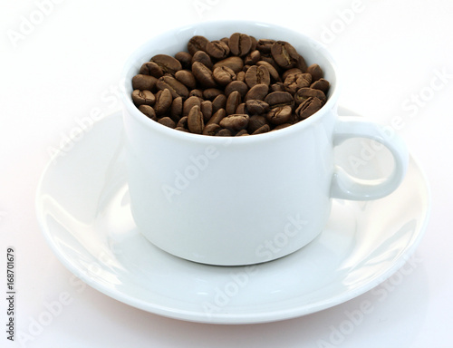 Cup of coffee beans on white background