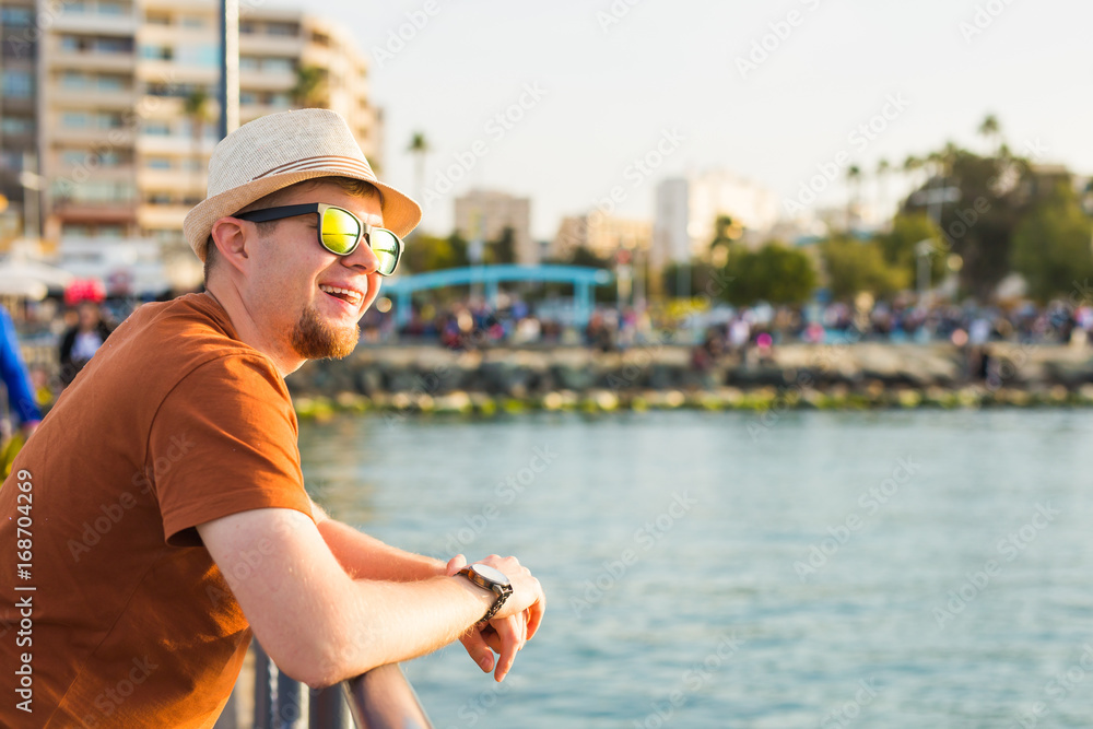 Man in sunglasses in seashore