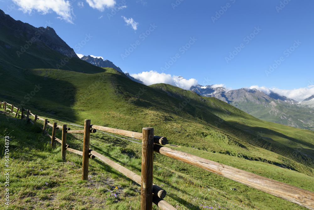 Mountain wooden  fence. Mountain rural road