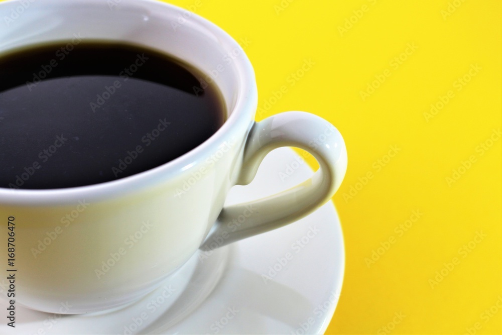 An Image of a Cup of coffee - yellow background An Image of a Cup of coffee - yellow background