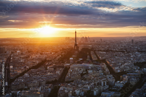 Spectacular view of Paris, France, from the Tour Montparnasse with the Eiffel Tower at sunset. Beautiful skyline. Travel background.