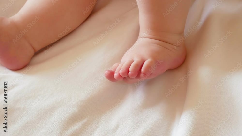 Two little feet a newborn baby On a white background. Full HD 1080p