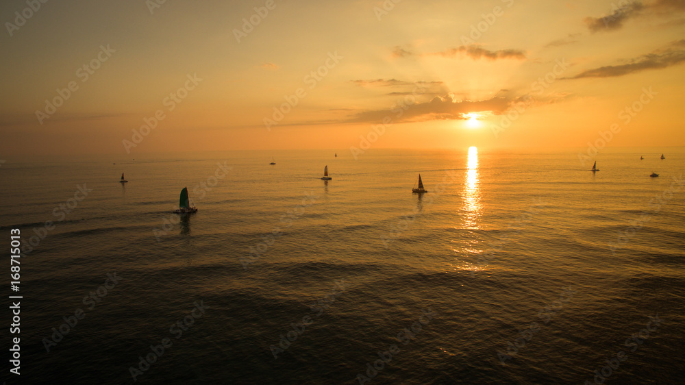 Golden sunset catamaran ride sailing ocean Golden sunset catamaran ride sailing ocean