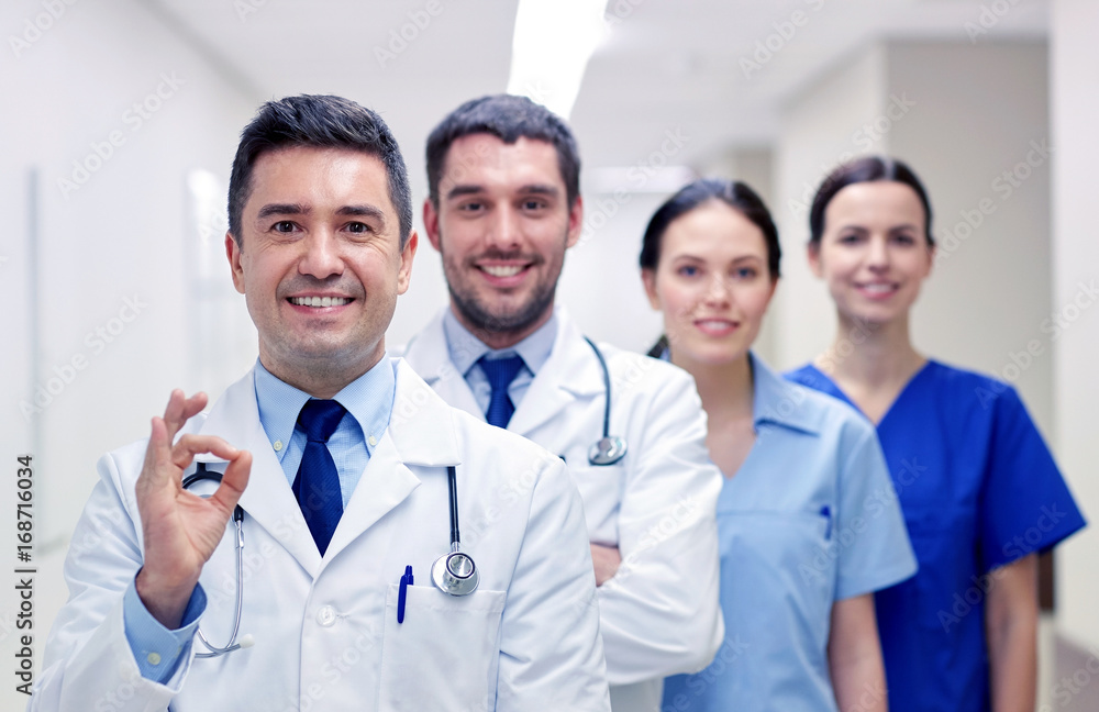group of happy medics or doctors at hospital group of happy medics or doctors at hospital
