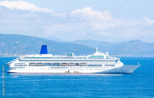 Big cruise ship in the blue sea in summer. Beautiful seascape. © parntawan1987