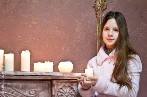 The girl the teenager with candles photo