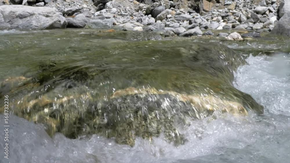 Water in a mountain river in slow motion video. Water in a mountain river in slow motion video.