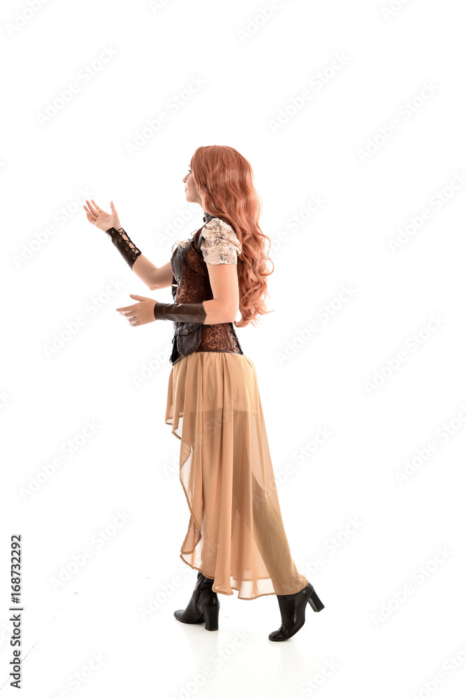 full length portrait of a red haired lady wearing steampunk inspired outfit, standing pose against a white background. full length portrait of a red haired lady wearing steampunk inspired outfit, standing pose against a white background.