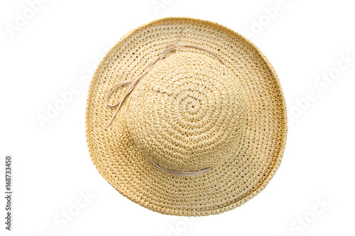 Pretty straw hat with bow on white background. Beach hat top view isolated