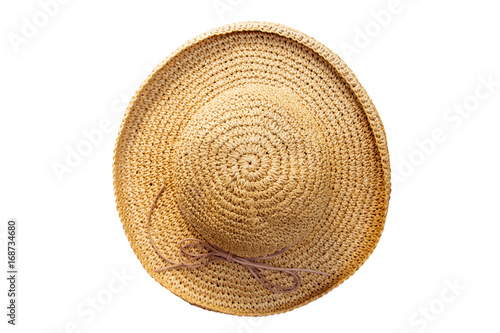 Pretty straw hat with bow on white background. Beach hat top view isolated