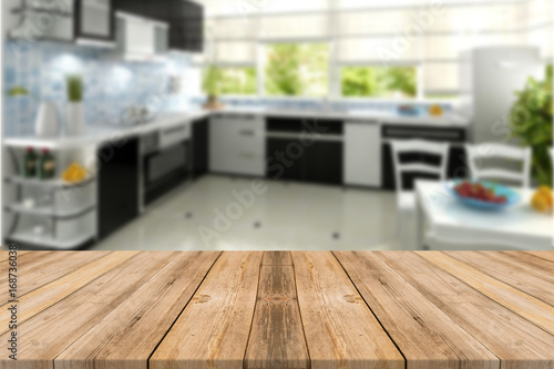 Empty light wood table top with kitchen  background. Leave space for placement you background - can be used for display or montage or mock up your products.