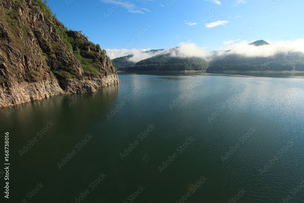 Landscape with Vidraru lake, Transfagarasan, Fagaras Mountains in Southern Carpathians, 
Romania.