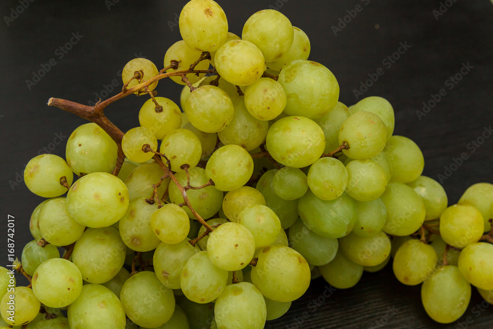 Sultana grape on the dark grey kitchen table
