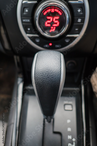 Closeup gear stick driving car. interior of modern car .