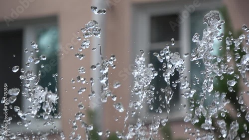 4K Water drops on the top of the fountain 100Mbps photo