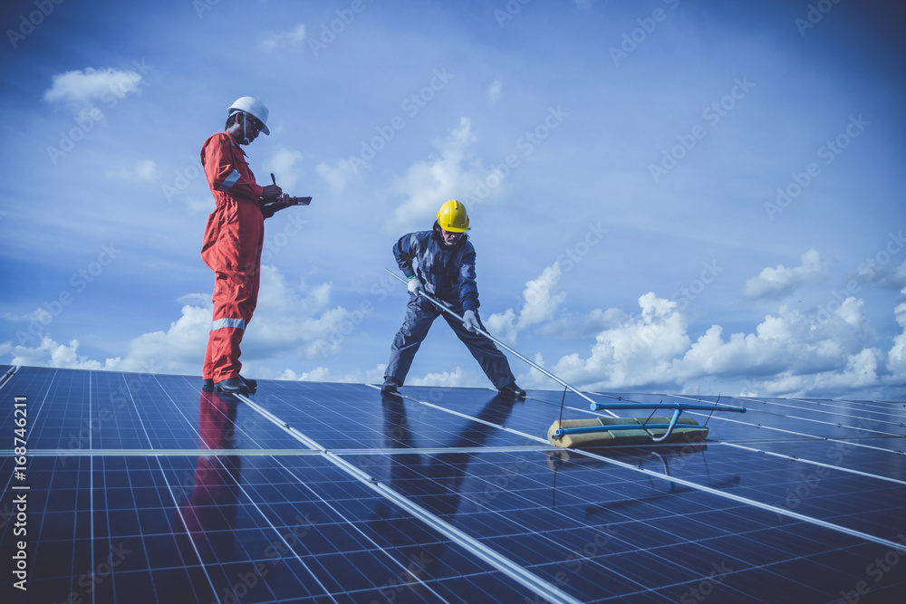 labor working on cleaning solar panel with water clean at solar power plant
labor working on cleaning solar panel with water clean at solar power plant