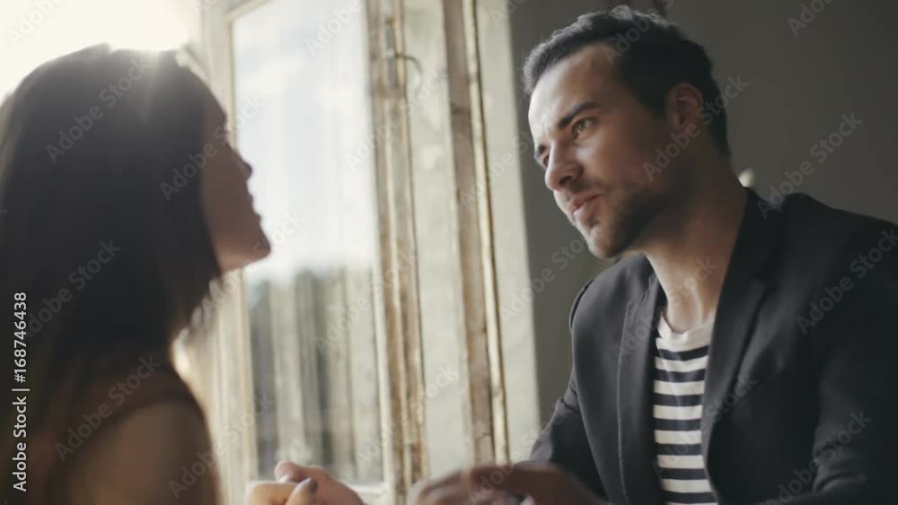 Romantic evening lovers in a cozy apartment near balcony. Romantic evening lovers in a cozy apartment near balcony.