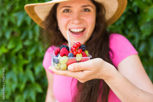 Young happy girl with fresh berries