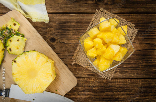 Wooden table with Sliced Pineapple, selective focus