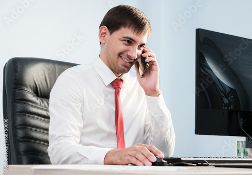 Young businessman communicating with client