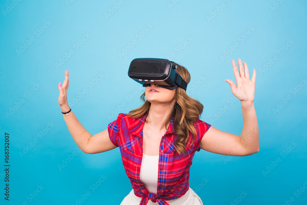 technology, virtual reality, entertainment and people concept - Woman with virtual reality goggles technology, virtual reality, entertainment and people concept - Woman with virtual reality goggles